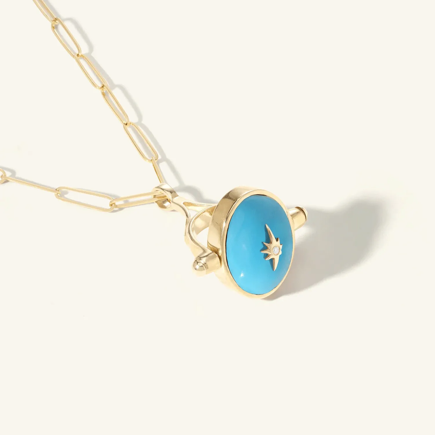 10 Karat Yellow Gold Oval Turquoise Spinning Pendant with Star Overlay