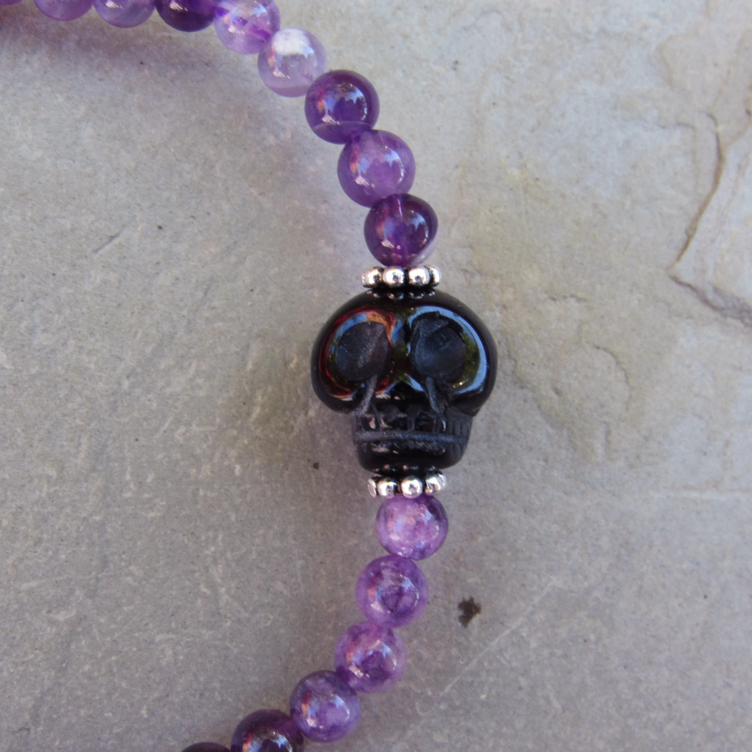 Amethyst gemstone, Onyx Skull, and Sterling Silver Women’s Stertch Bracelet