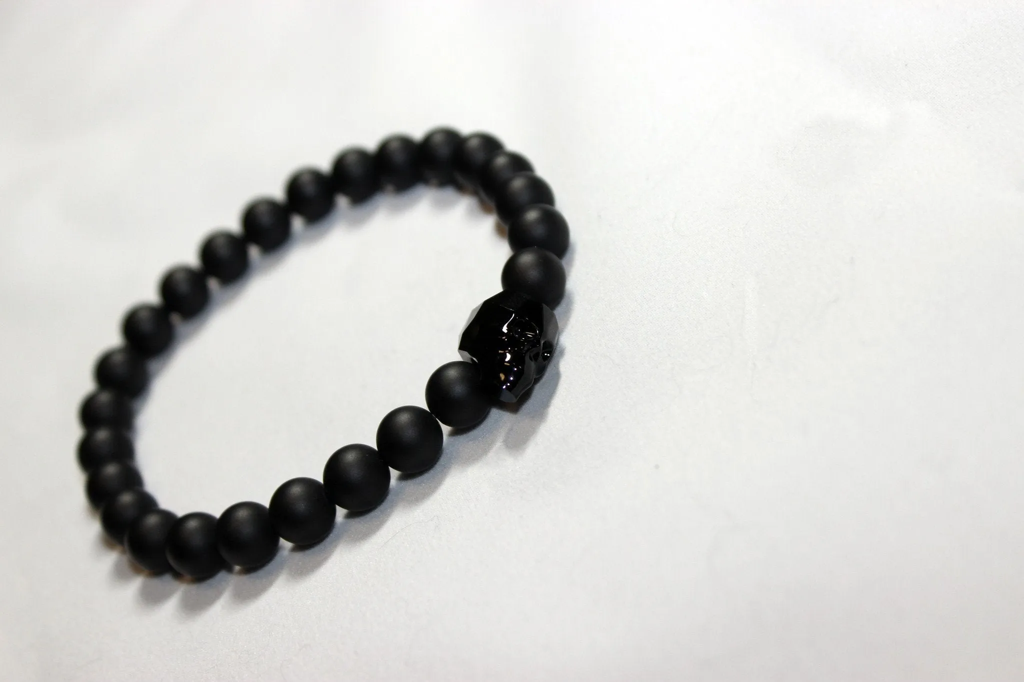 Black Onyx Bead Bracelet with Swarovski Crystal Skulls- UDINC0440